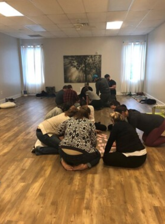 pregnant mothers and partners circled on floor at bradley® birthing class